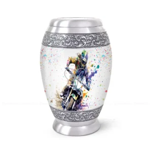 Freedom Rider 10-inch aluminum cremation urn featuring a High-Gloss Graphic Wrap of a motorcycle rider with colorful paint splatters and hand-engraved silver floral bands.