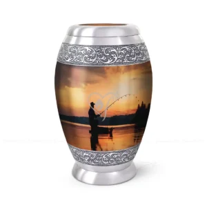 Golden Angler 10-inch aluminum cremation urn featuring a High-Gloss Graphic Wrap of a sunset fishing scene with hand-engraved silver floral bands.