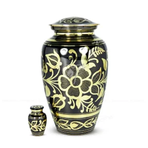 Florix 10-inch premium brass cremation urn featuring a black oxidized finish and intricate hand-engraved polished brass floral patterns with a secure threaded lid.