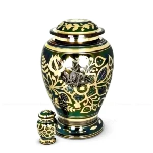 Emerald Meadow 10-inch premium brass cremation urn in an Atlantic shape, featuring a rich oxidized green finish and intricate hand-engraved polished brass floral patterns with a secure threaded lid.