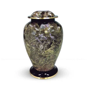 Midnight Zephyr 10-inch Atlantic shaped solid brass cremation urn featuring a high-gloss black finish with hand-chiselled golden brass random patterns.