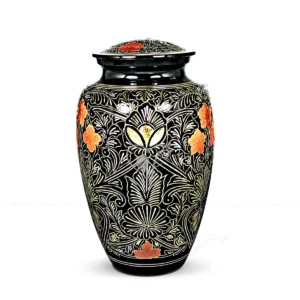 Bloomox 10-inch classic shaped solid brass cremation urn with a black finish and hand-chiselled brass floral patterns accented in copper.