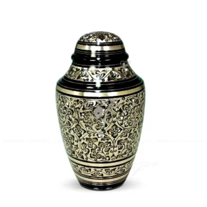 Obsidian Vine 10-inch contemporary dometop solid brass cremation urn with a black finish, hand-chiselled leaf patterns, and matte brass horizontal bands.