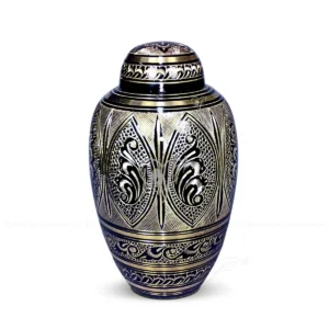 Midnight Flora 10-inch Dometop shaped solid brass cremation urn featuring a polished black finish and hand-chiselled golden brass floral patterns.