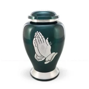 Eternal Devotion 10-inch aluminum cremation urn in an Atlantic shape, featuring a deep green glossy finish and silver praying hands with a secure threaded lid.