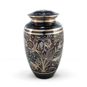 Midnight Meadow 10-inch premium brass cremation urn featuring a black steel finish with polished brass hand-engraved floral patterns.