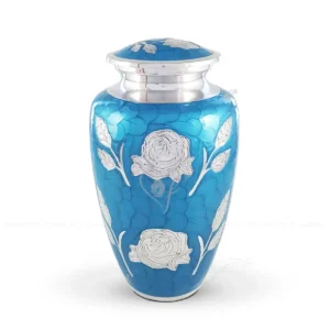 Azure Bloom 10-inch classic aluminum cremation urn featuring a hand-applied sky blue glossy meena finish and hand-engraved shiny aluminum rose design.