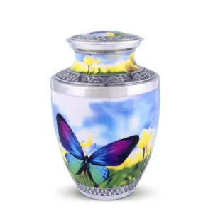 Butterfly Meadow 10-inch Treisty shape aluminum cremation urn featuring a vibrant butterfly and floral field design with hand-engraved silver-tone floral bands.