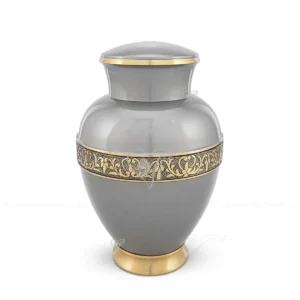Aurelian 10-inch brass adult cremation urn in metallic grey finish with brushed brass floral bands and accents.