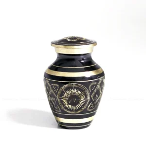 Black Radiance Elite 3-inch black brass keepsake urn with hand-engraved chiseled brass sunburst designs.