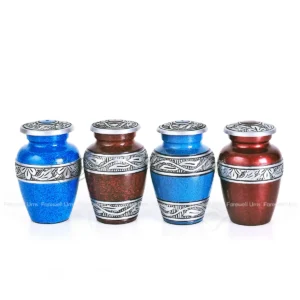 Ceresta Collection aluminum keepsake urn set in blue and crimson red with hand-engraved floral bands.